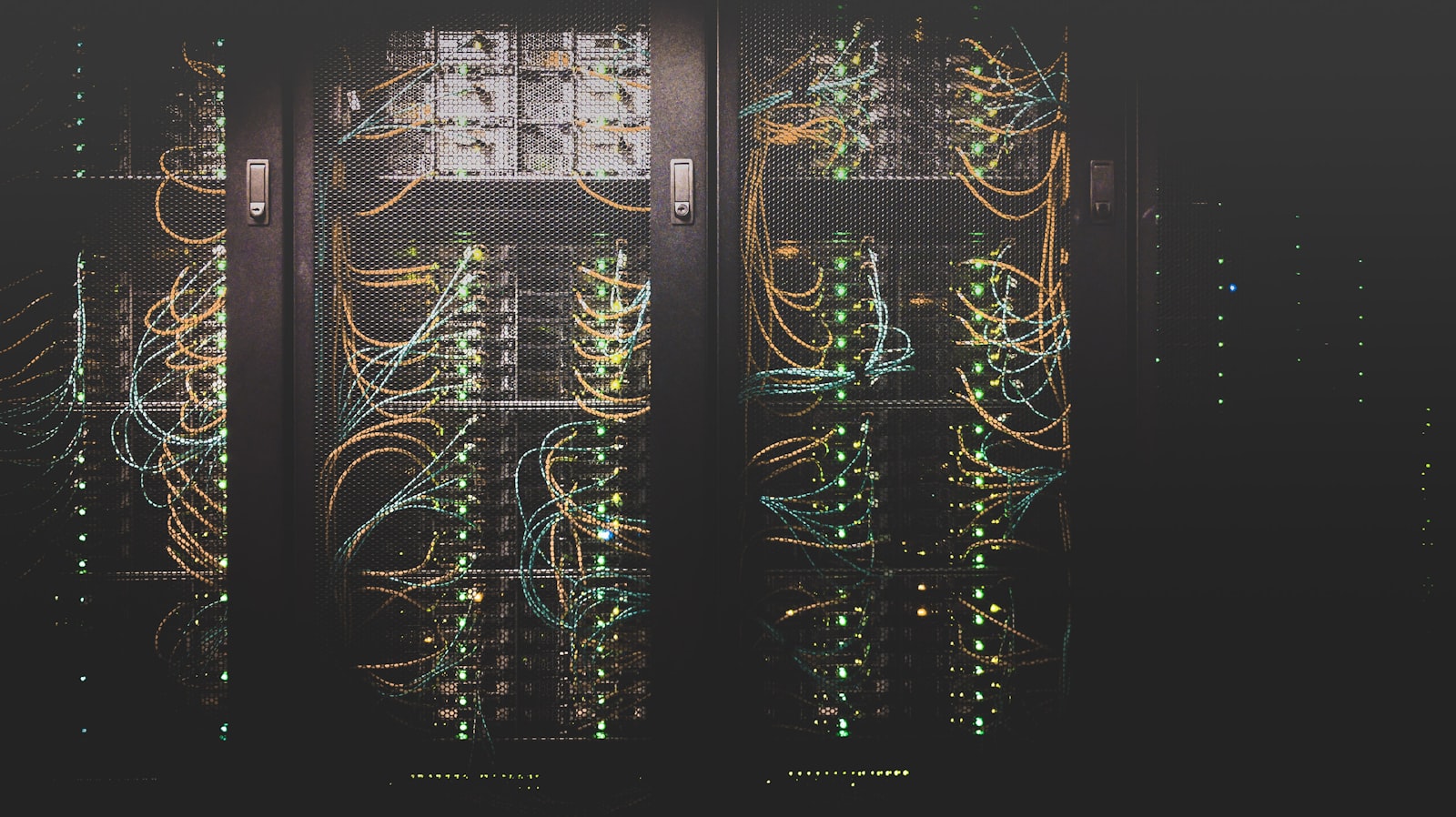 A dimly lit server room corridor